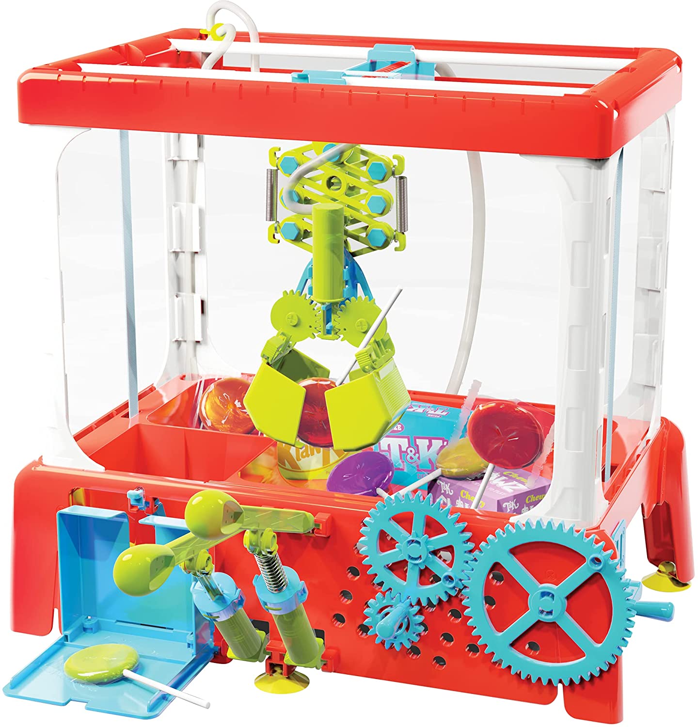 A scaled-down claw machine is depicted grabbing a lollipop (amongst other candies). Working gears and levers are along the base of the machine. 